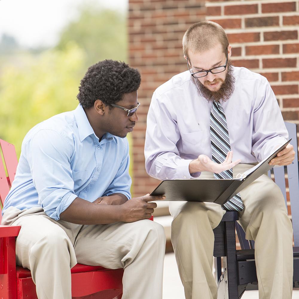 Students reviewing papers